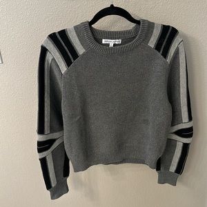 Rebecca Minkoff sweater with detailed sleeves.